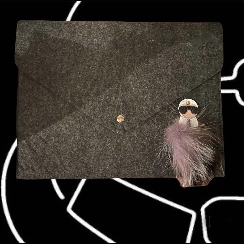 Fabulous Grey wool envelope bag with famous little guy hanging about